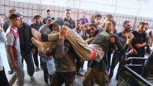 Israeli troops open fire on Palestinians headed to GHF hub, killing 32