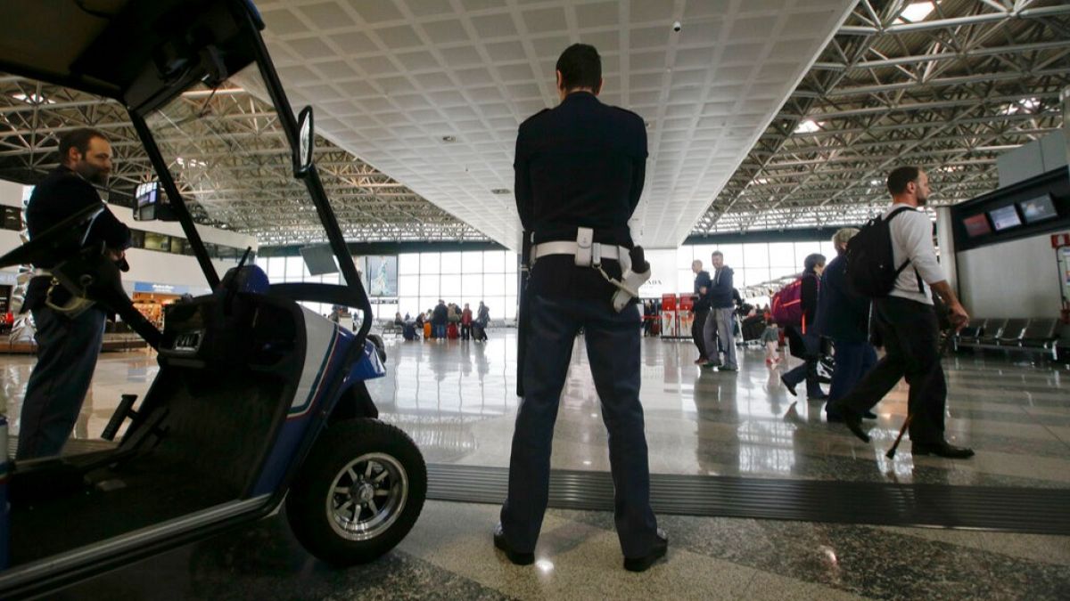 Passengers evacuated from Italian airport after 'lunatic' starts fire